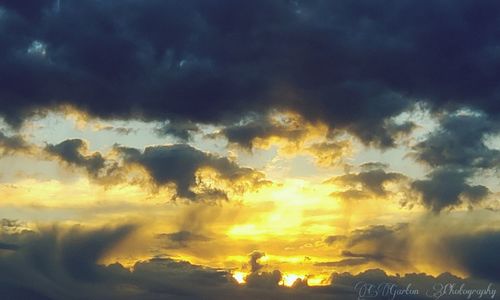 Low angle view of dramatic sky during sunset