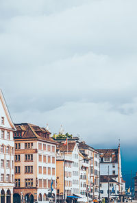 Buildings in town against sky