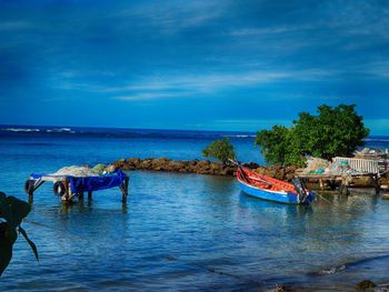 Scenic view of sea against blue sky