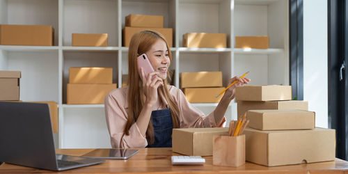 Young woman using laptop at home