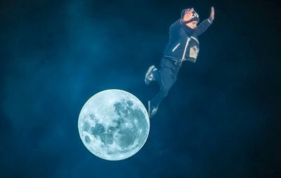 Scenic view of moon against blue sky