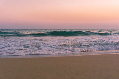 Scenic view of sea against clear sky during sunset
