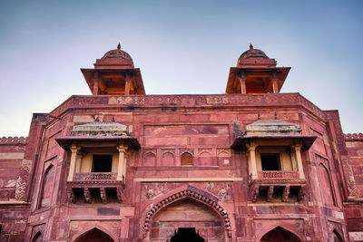 Low angle view of old building against sky