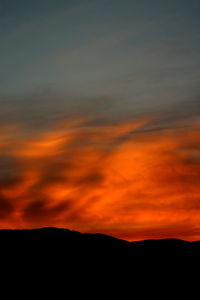 Scenic view of dramatic sky during sunset