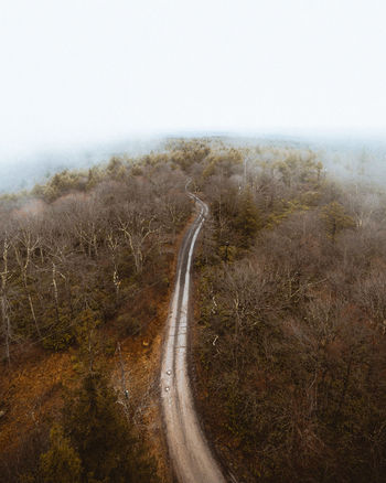 Aerial view of road on land against sky