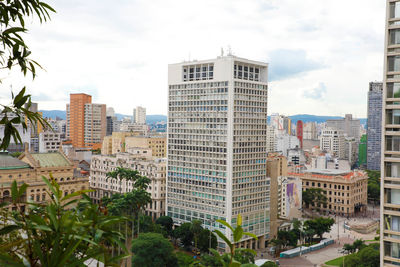 Buildings in city against sky