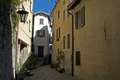 Narrow alley amidst buildings in town