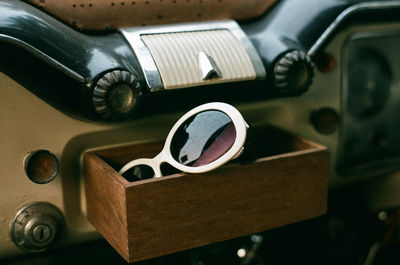 Close-up of sunglasses in vintage car