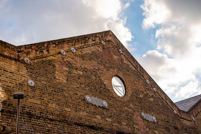 Low angle view of old building against sky