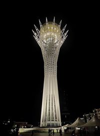 Low angle view of illuminated ferris wheel at night