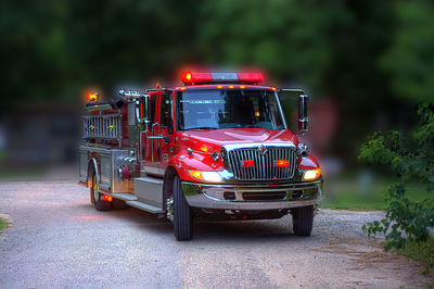 High angle view of illuminated fire on street at night