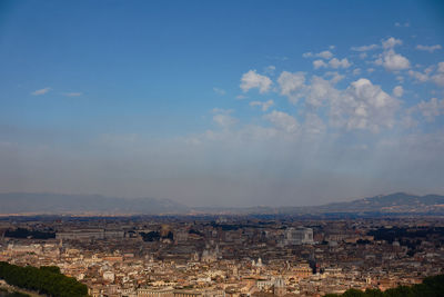 Aerial view of townscape against sky