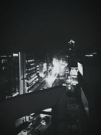 High angle view of illuminated buildings in city at night