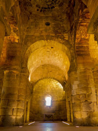 Illuminated corridor of historic building