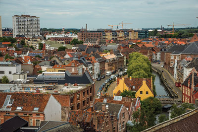 Old buildings seen from the gravensteen castle at ghent. a city full of gothic buildings in belgium.