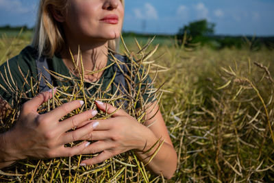 Young woman sitting on field