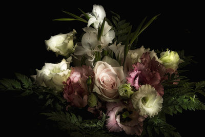 Close-up of rose bouquet against black background