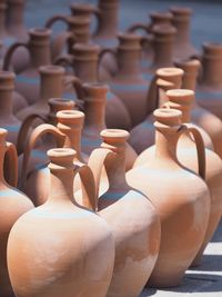 Close-up of potteries arranged for sale