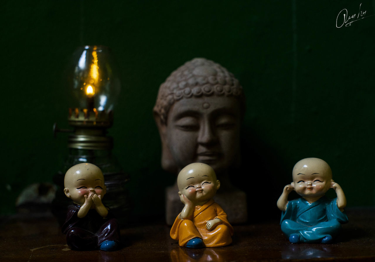 CLOSE-UP OF BUDDHA STATUE