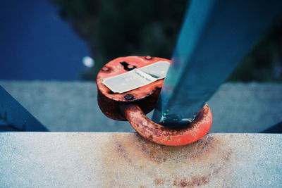 Close-up of padlock attached to railing