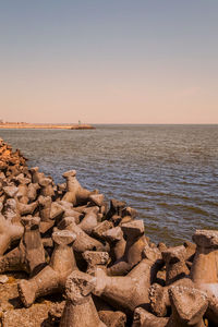 Scenic view of sea against clear sky at sunset