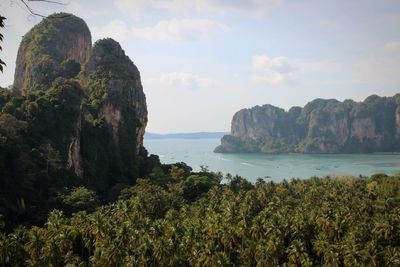 Scenic view of mountains and sea against sky