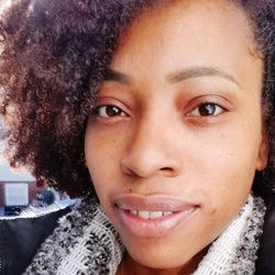 Close-up portrait of a smiling young woman