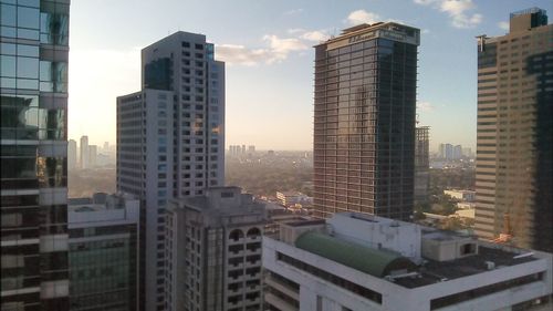 Skyscrapers in city against sky