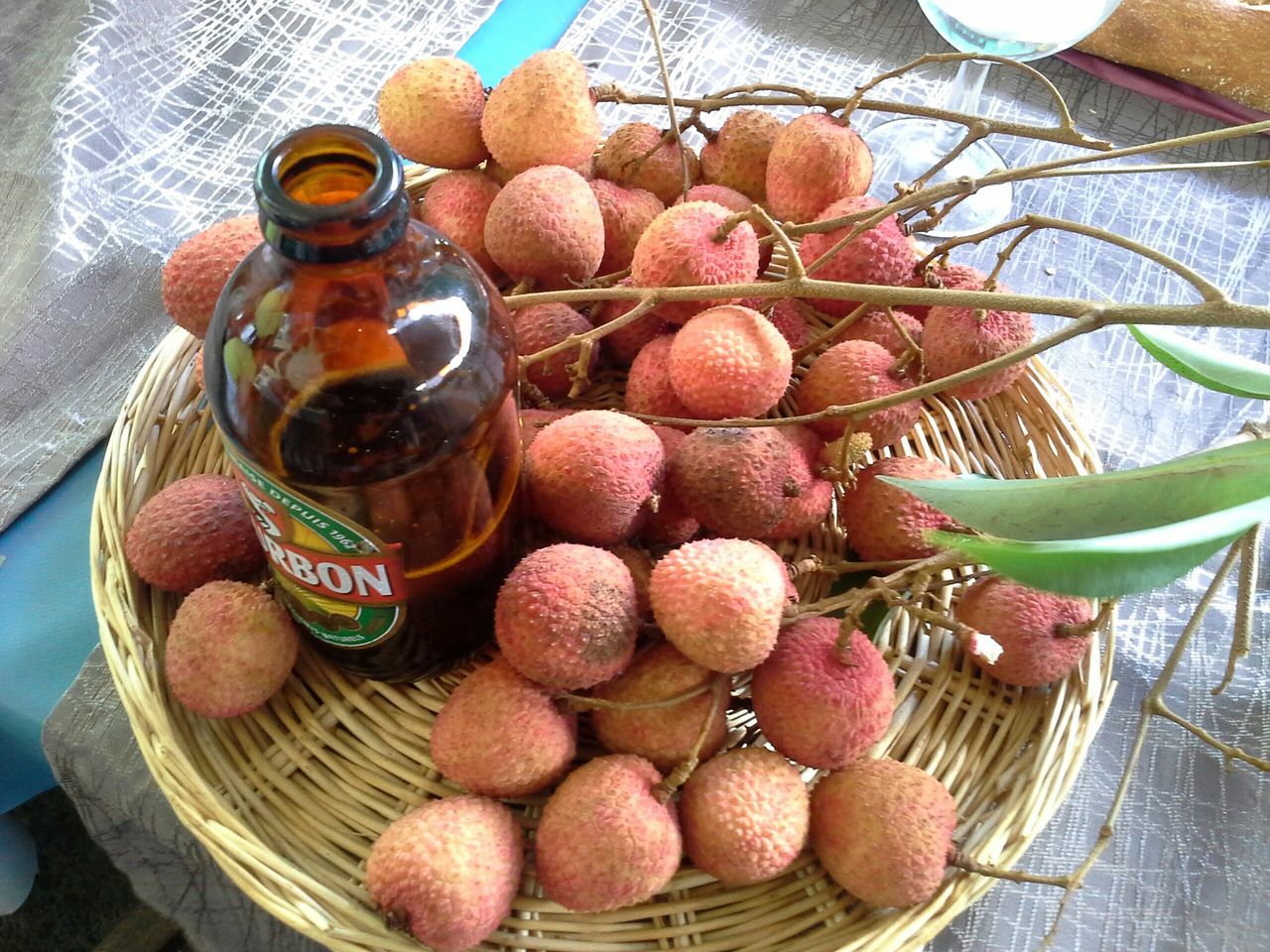 food and drink, food, freshness, still life, healthy eating, fruit, indoors, high angle view, table, variation, large group of objects, wood - material, abundance, close-up, no people, basket, choice, stack, grape, day