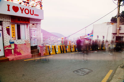 Road amidst buildings in city