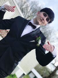 Young man holding umbrella