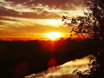 Scenic view of sunset over river