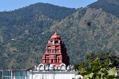 View of a building with mountain range in the background