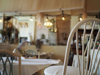 Empty chairs and table in restaurant