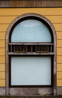 Low angle view of window on wall