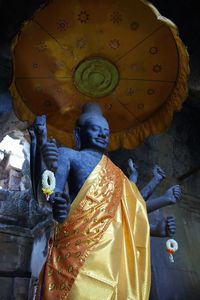 Low angle view of statue against building