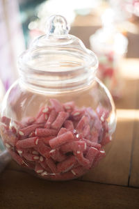 Close-up of ice cream in glass jar on table