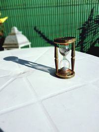 Close-up of hour glass on table