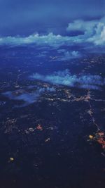 Aerial view of landscape against cloudy sky