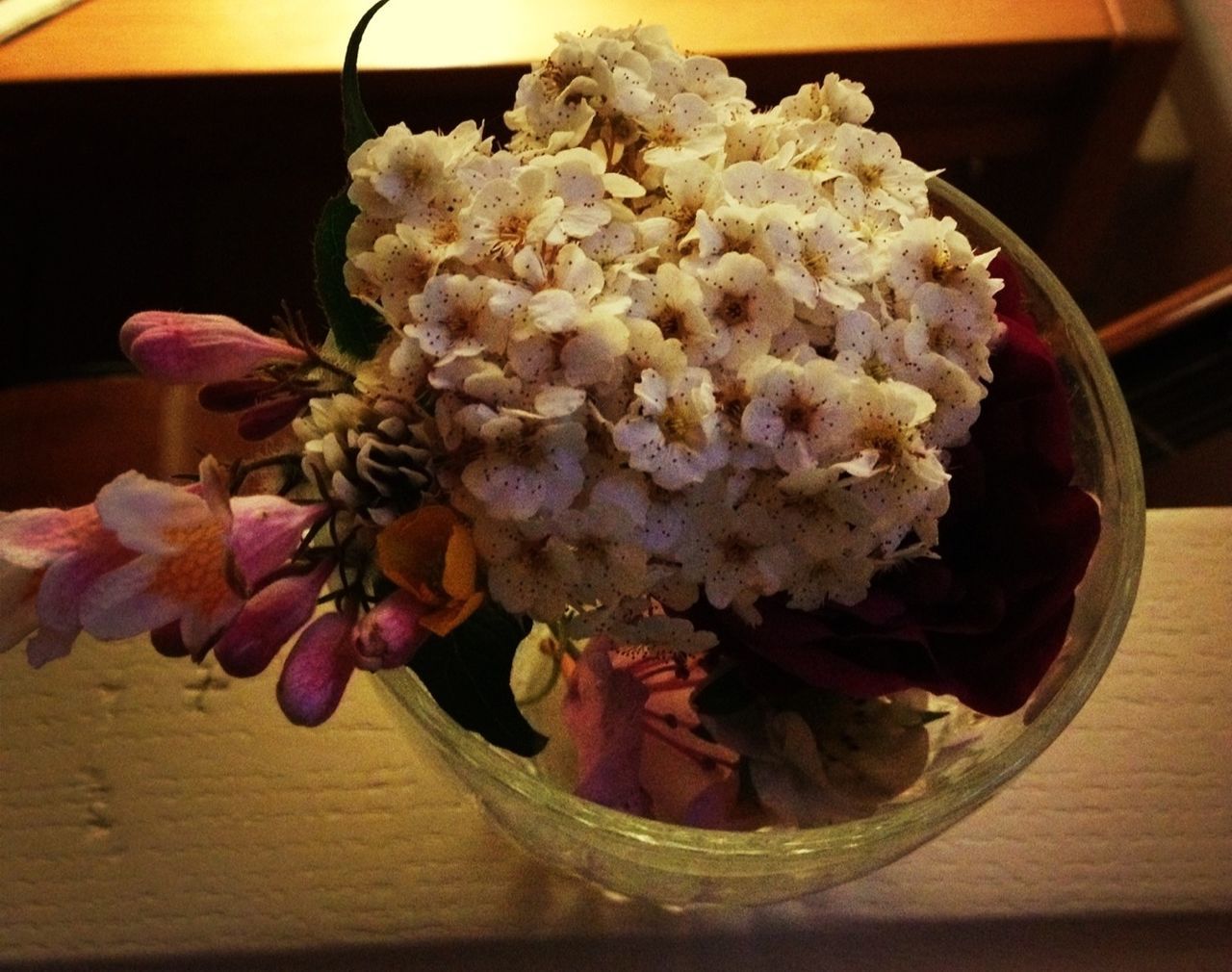 indoors, freshness, flower, table, food and drink, food, still life, close-up, vase, ready-to-eat, petal, high angle view, no people, fragility, plate, healthy eating, sweet food, indulgence, wood - material, decoration