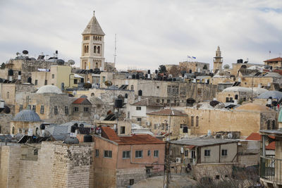 View of buildings in town against sky