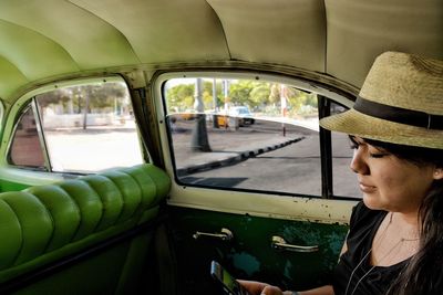 Close-up of woman sitting in car