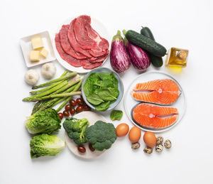 High angle view of chopped vegetables on white background