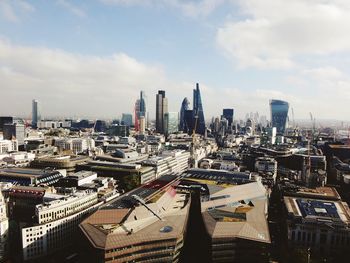 High angle view of buildings in city against sky