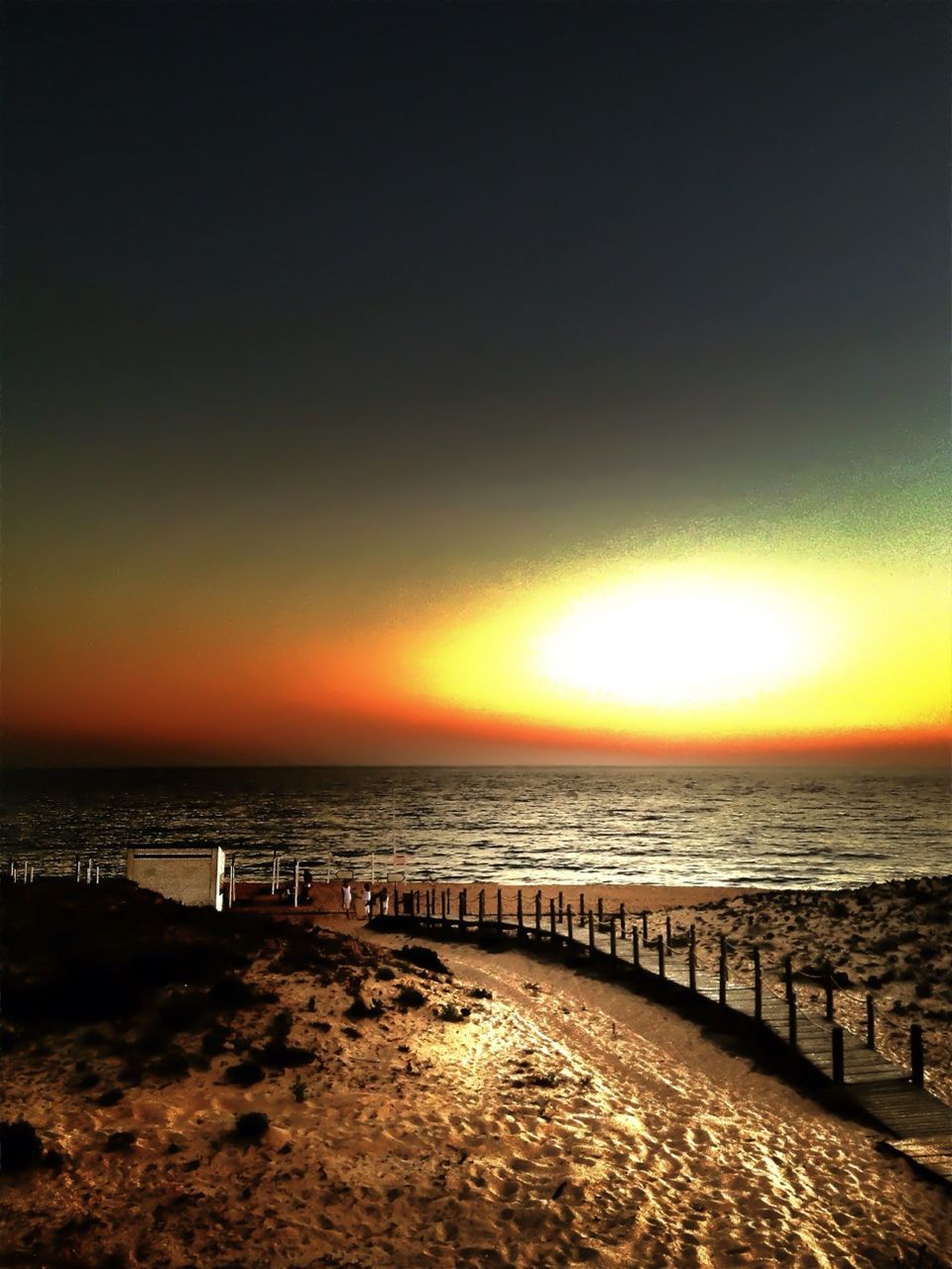 sea, horizon over water, water, sunset, scenics, tranquil scene, beach, tranquility, beauty in nature, orange color, sun, shore, idyllic, sky, nature, reflection, sunlight, outdoors, remote, no people