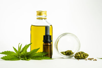 Close-up of glass bottle against white background