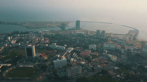 High angle view of buildings in city against sky