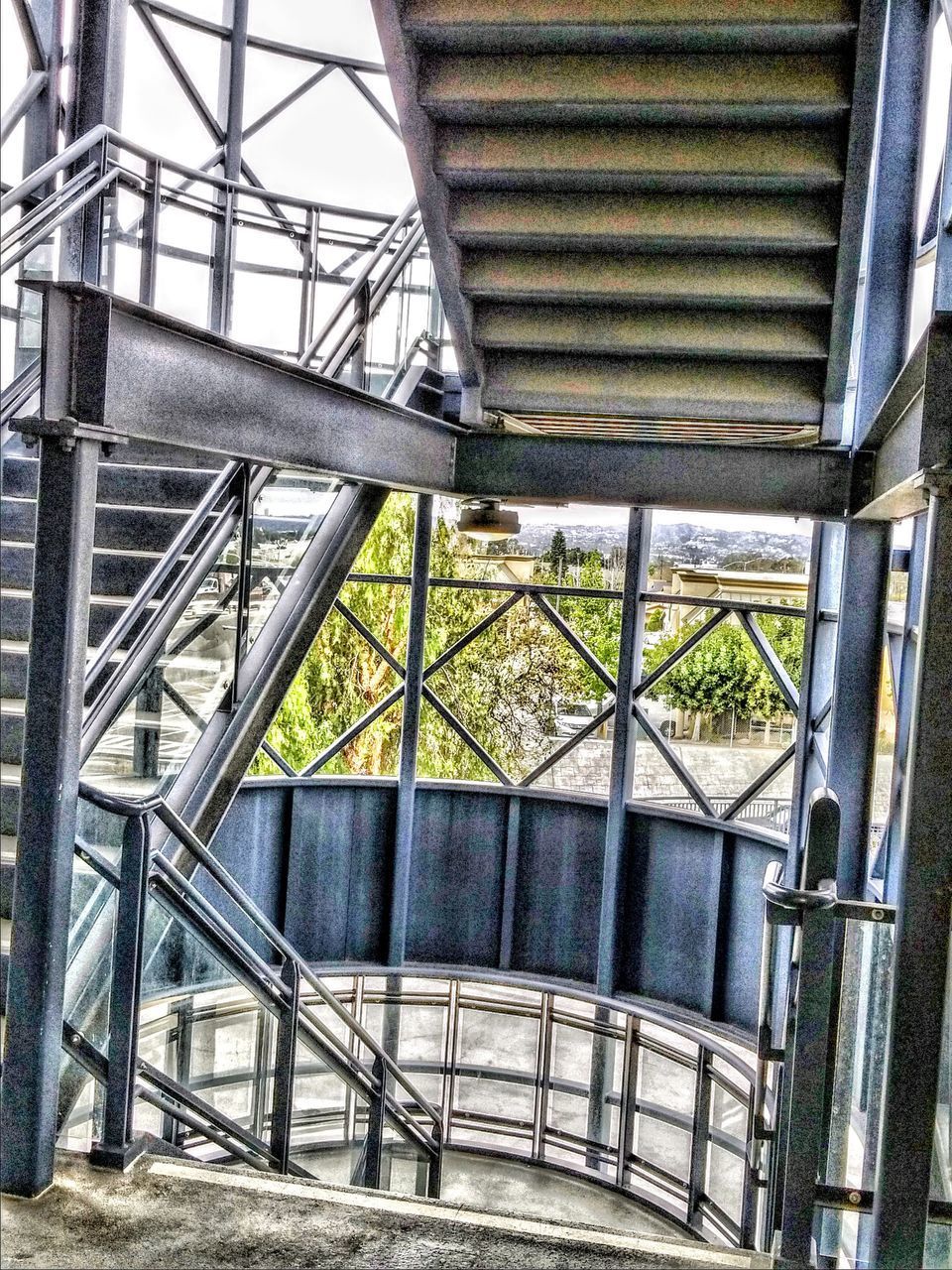 LOW ANGLE VIEW OF METALLIC STAIRCASE IN BUILDING