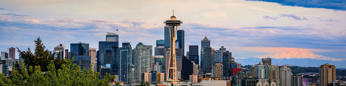 Modern buildings in city against sky