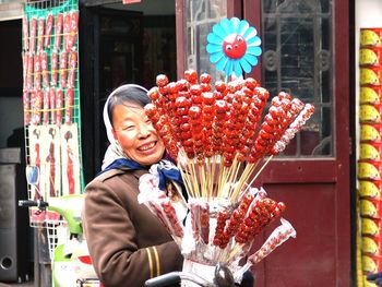 Close-up of woman holding flowers